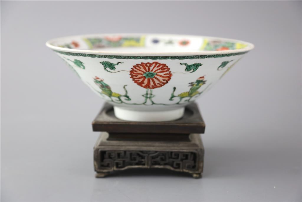 A Chinese famille verte conical shaped bowl, Kangxi period, 20.5cm diameter, ebonised wood stand